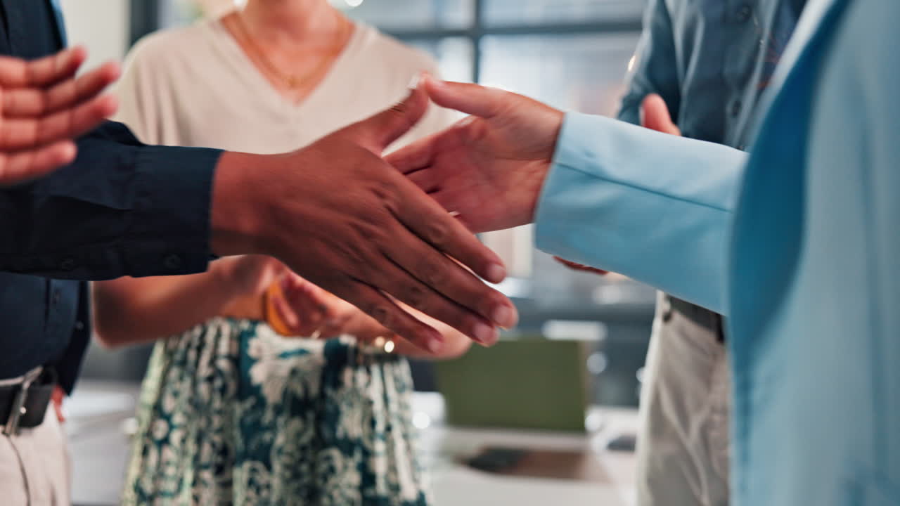 Businesspeople shaking hands in an office