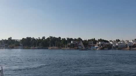 Panorama-view-of-Elephantine-Island-riverbank,-tranquil-Nile-river-waters,-Egypt