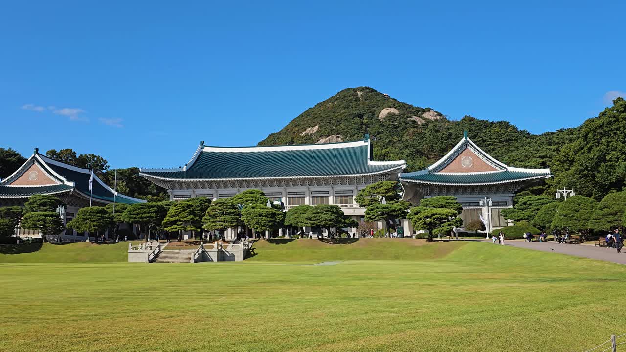 Cheong Wa Dae Blue House - Former Presidential Residence in Seoul with Bugaksan Mountain in Background, South Korea - Tourist's walking pov