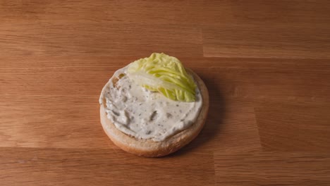 burger toppings stacked up for a meal timelapse