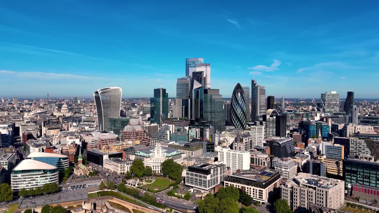 Stunning aerial views of London's skyline, showcasing iconic buildings like the Walkie-Talkie and Gherkin. As the drone glides back, the Tower of London, River Thames, and Tower Bridge come into view.