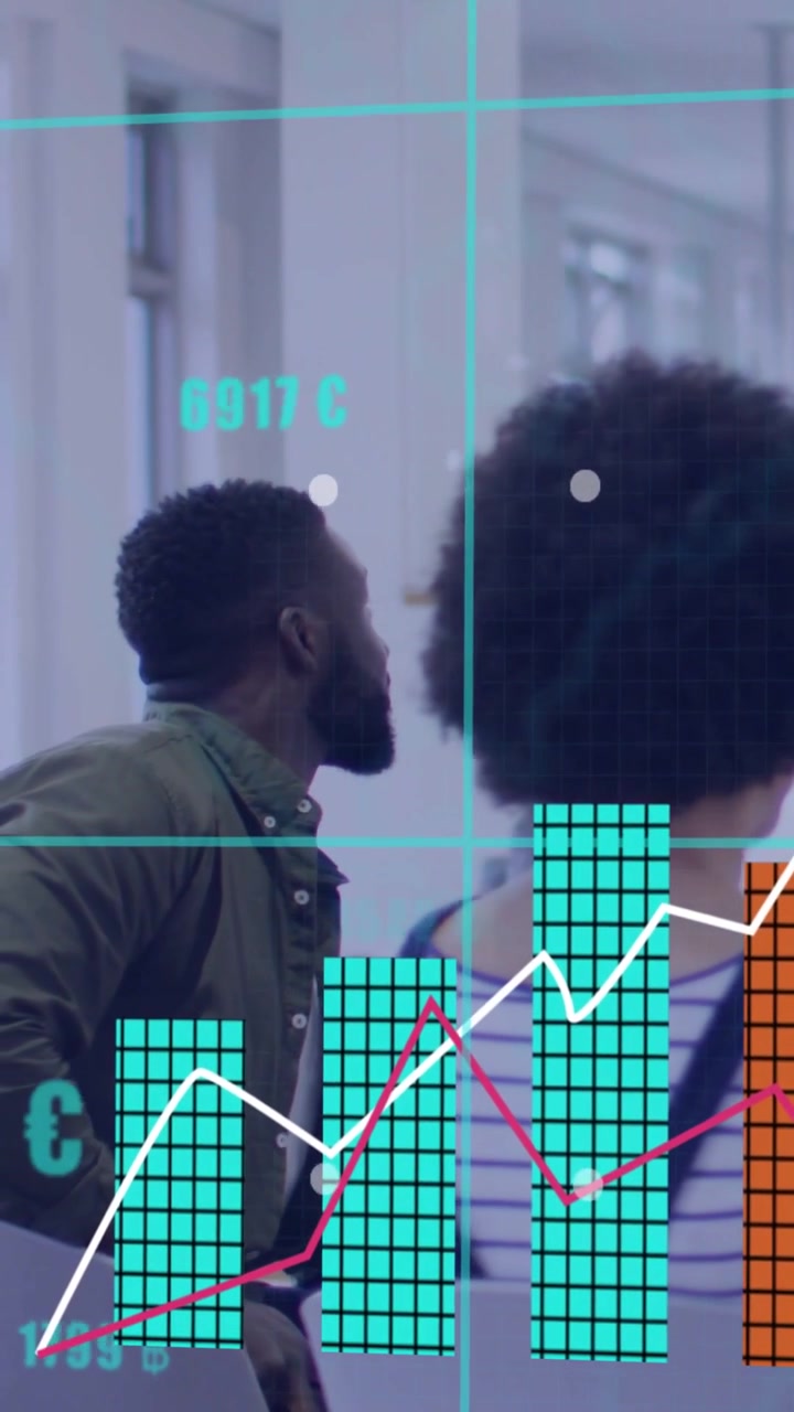 Vertical video: Two colleagues watching analytics as update triggers teal columns covering them