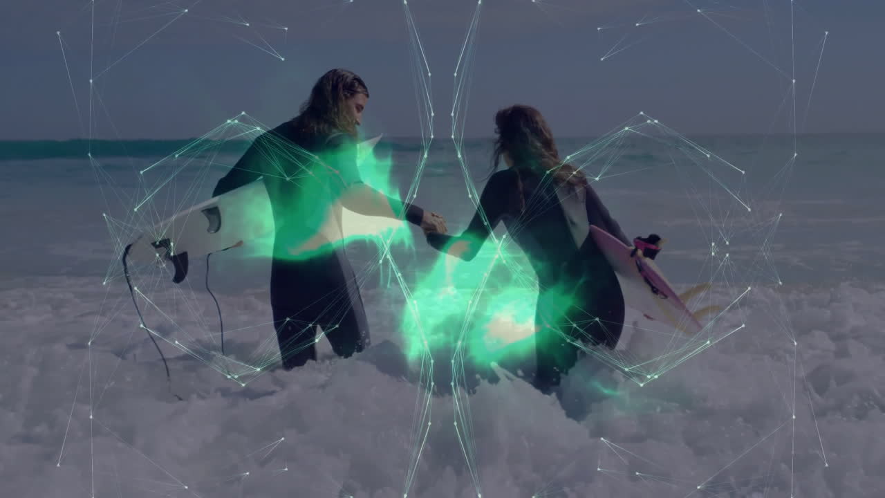 surfer couple wading into surf with surfboards, showcasing technology via augmented reality overlay