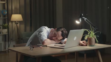 tired worker napping at desk