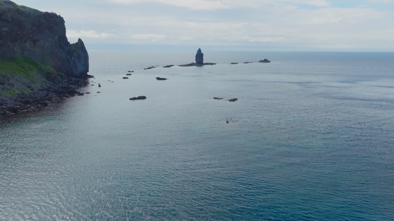 Aerial drone fly above reflected japanese sea in Shakotan Hokkaido travel destination, famous stone beach