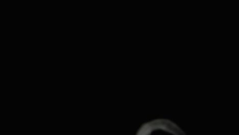 smoke rings of dry ice in motion on a black background. closeup