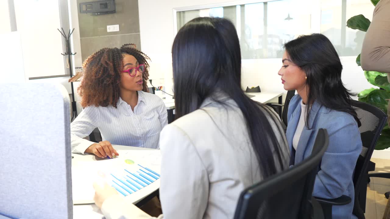 Business meeting with diverse women in the office