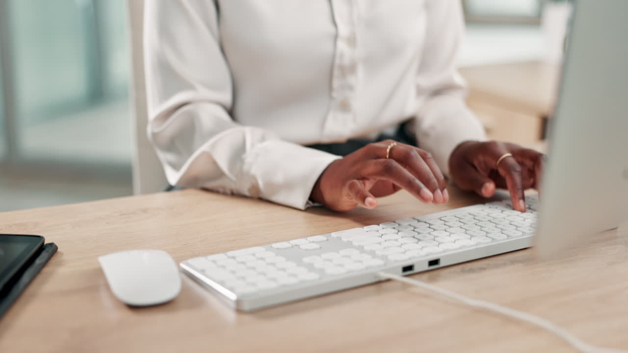 Woman typing on a computer