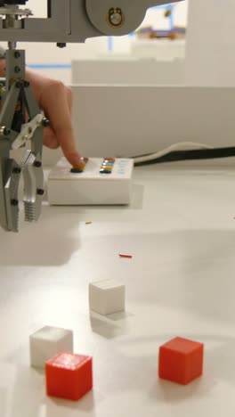young child playing with robot