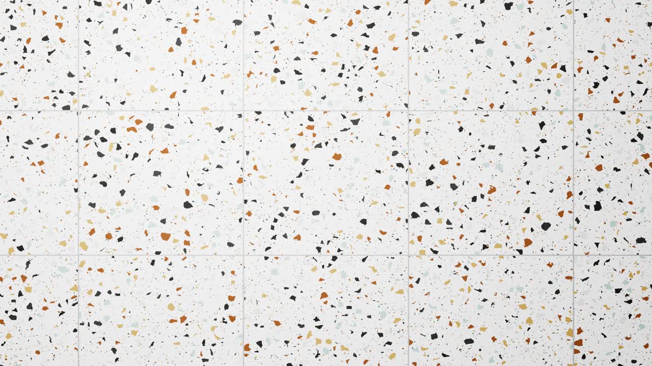 Motivo a terrazzo colorato su piastrelle bianche