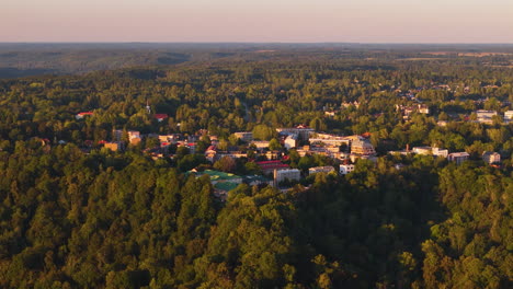 high aerial birds eye flight approaching latvia's top tourist attractions: monuments, museums, and historical buildings in sigulda, vidzeme, latvia.
