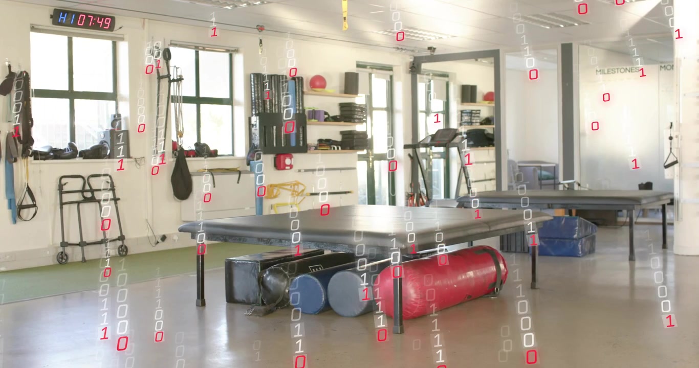 Binære cifre dannes i loftet, kaskader ned gennem genoptræningsrummet og omslutter værktøjer for en digital effekt.