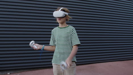 boy playing virtual reality game outdoors