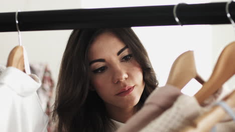 attractive young woman shopping for clothes