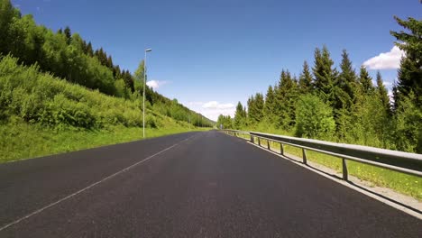 driving a car on a road in norway time laps