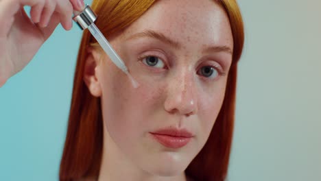 woman applying facial cream