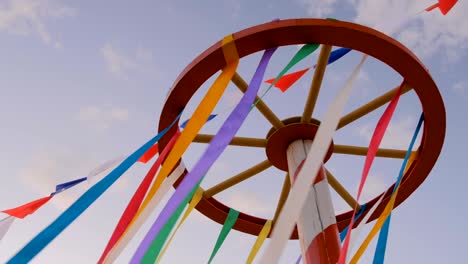 decorative multicolor ribbons on wooden wheel construction