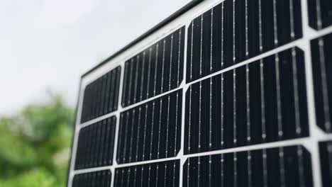 close up of monocrystalline solar panel cells sunlight shining through, day