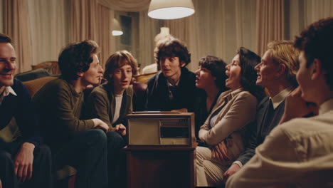 group of friends listening to a radio