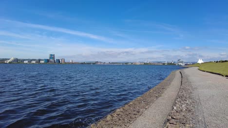 cityscape over a lake on a sunny day
