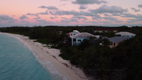 Aerial-shots-of-beautiful-beach-houses-on-Exuma-Island,-The-Bahamas-at-sunset
