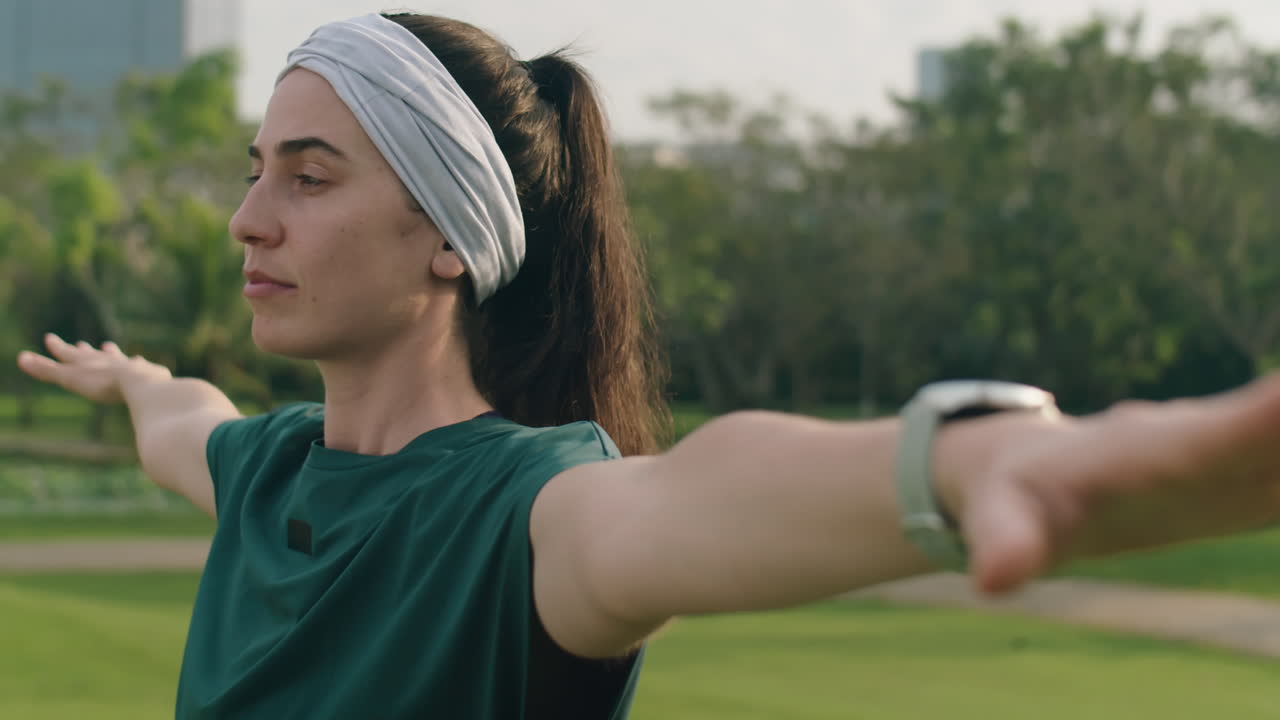Woman Having Yoga Workout in Park