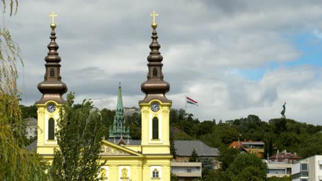 Liberty-Statue-and-Church-Tower-Close-up-and-Hungarian-Flag-Slow-Motion