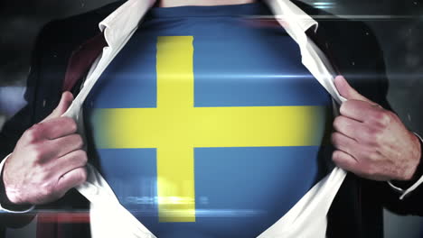 businessman opening shirt to reveal sweden flag