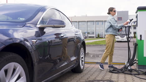 young woman getting off a car