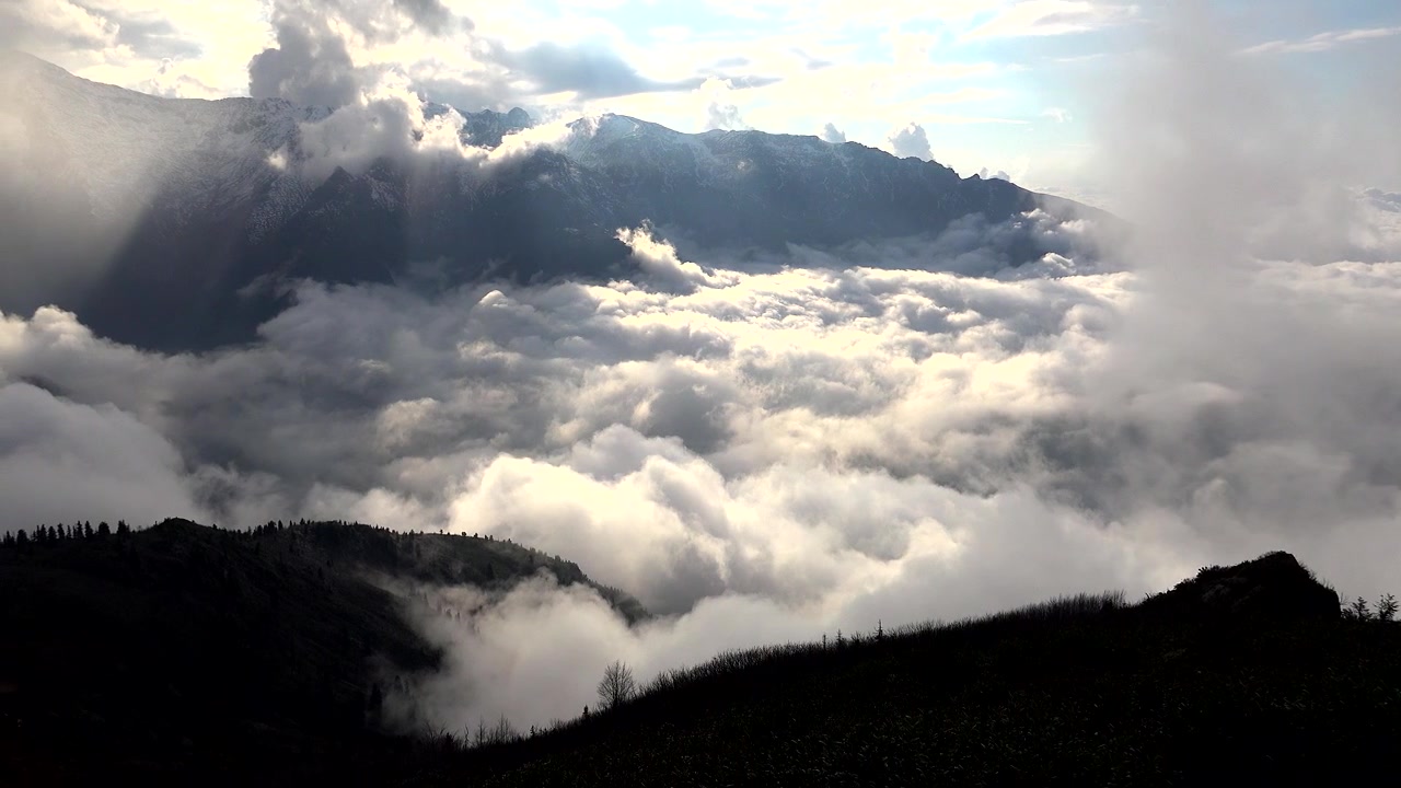 Aerial View of Thick Clouds Covering Mountain Valley