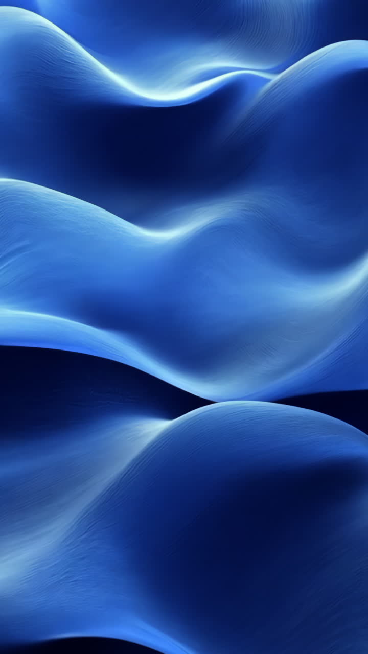 The image is a blue wave with a lot of detail. The blue color is very vibrant and the wave looks very realistic. Vertical video