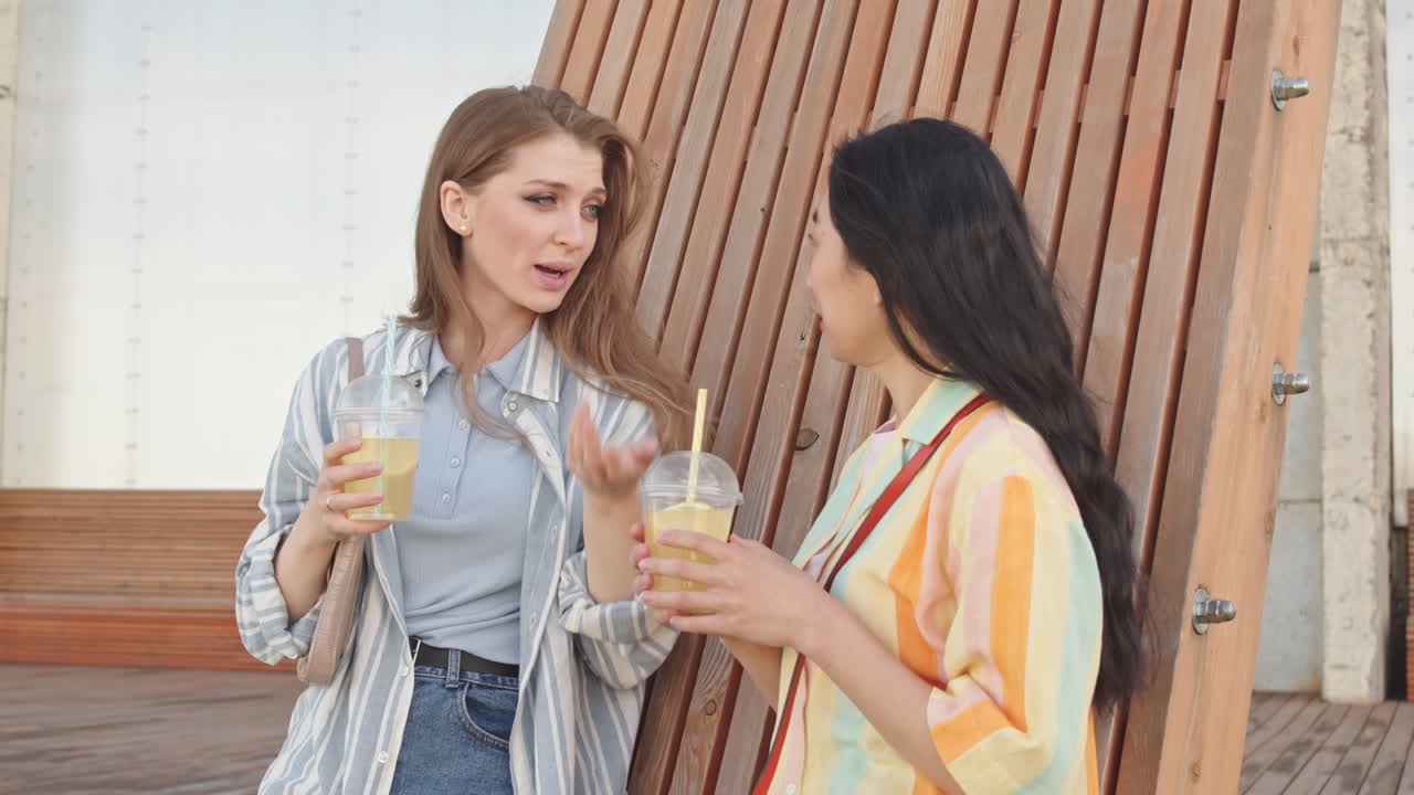 Girlfriends Chatting Outdoors in Summer