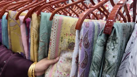 woman shopping for colorful printed fabrics