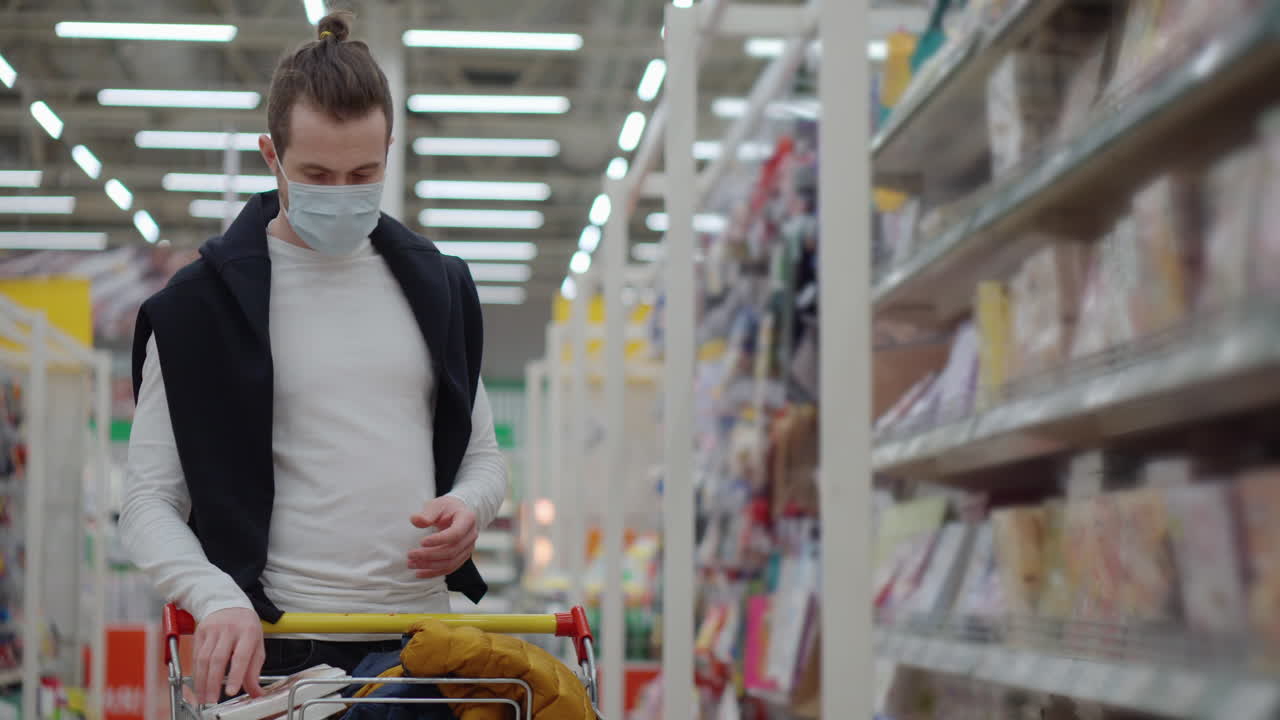 Man Shopping in a Supermarket During Pandemic