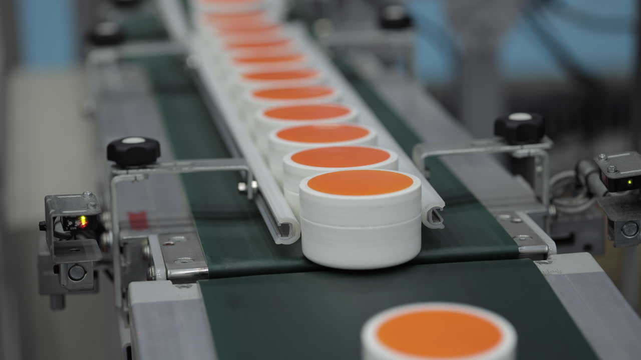 Cosmetics on a conveyor belt in a factory