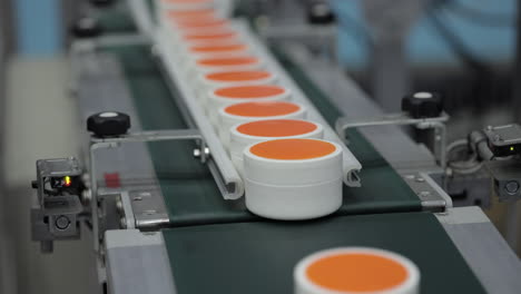 cosmetics on a conveyor belt in a factory