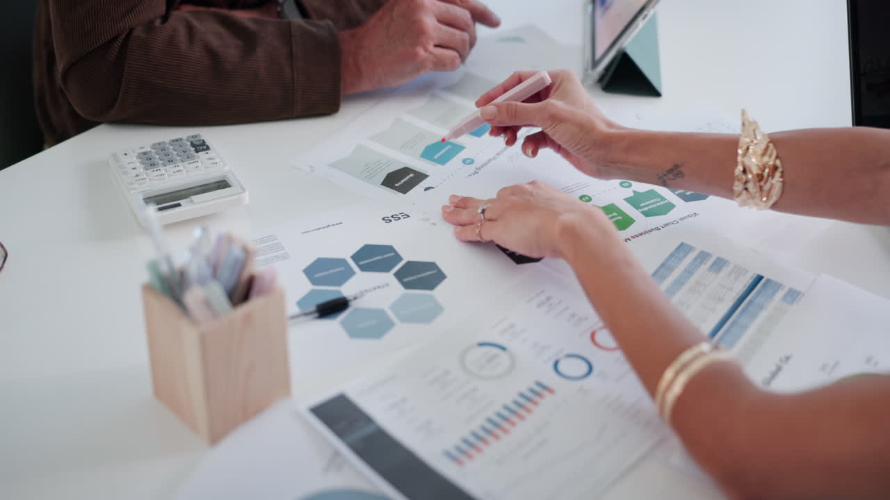 Business People Analyzing Financial Data and Charts in Office Meeting