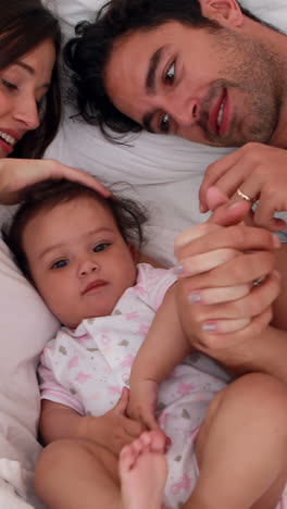 loving parents playing with their baby