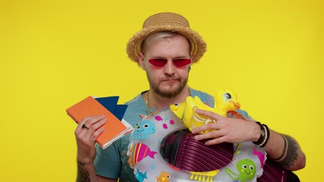 Displeased-tired-boring-traveler-tourist-bearded-stylish-man-in-summer-clothes-on-yellow-background