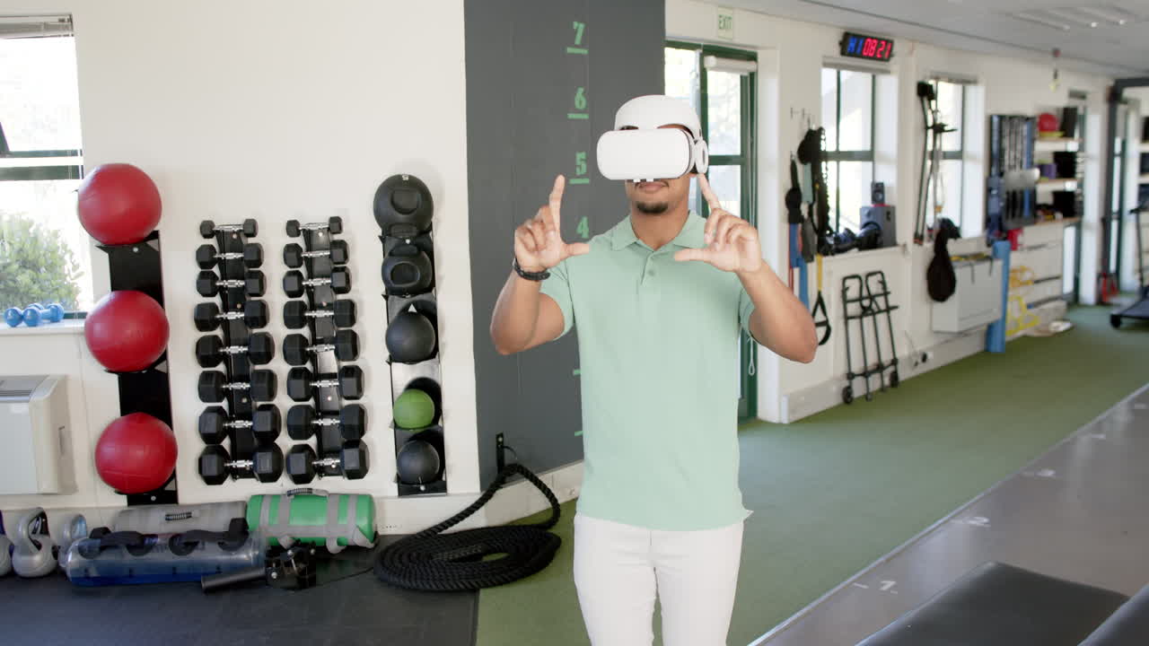 Using VR headset, man in rehabilitation center engaging in virtual therapy exercises