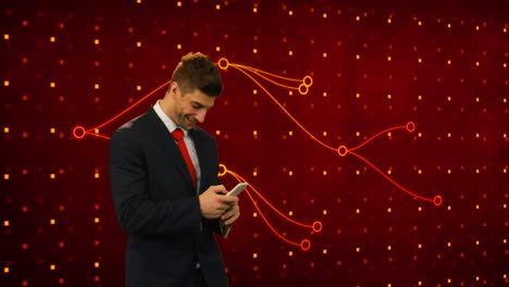 animation of caucasian businessman using smartphone over red background with dots