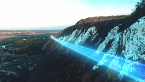 aerial view of mountains with blue light beam