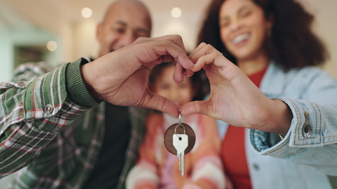 Happy Family Holding Keys to New Home