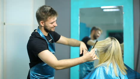 professional hair care. woman cutting her hair in hairdresser salon