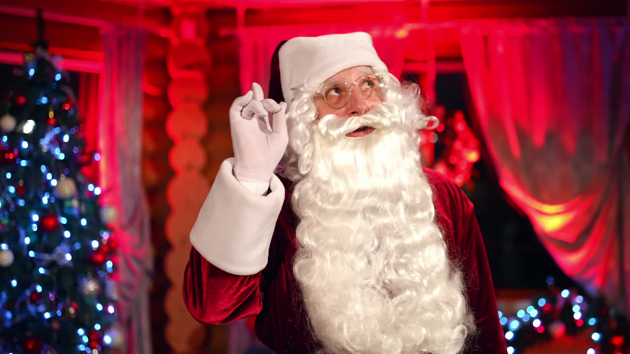 Portrait of bearded Santa Claus. Santa clause standing in specially decorated room
