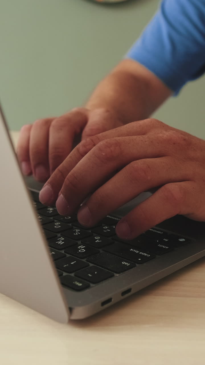 Typing on a laptop