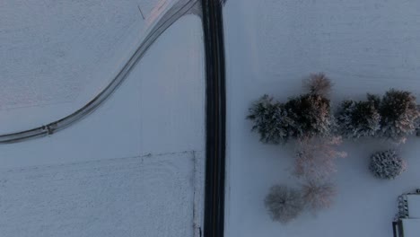 Road-through-a-Snow-Covered-Countryside-before-Sunrise