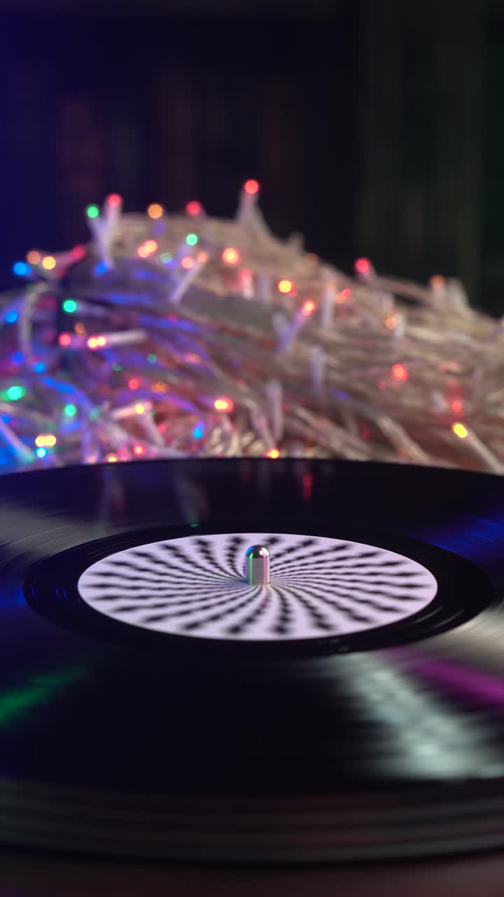 Vinilo girando con luces de Navidad parpadeantes