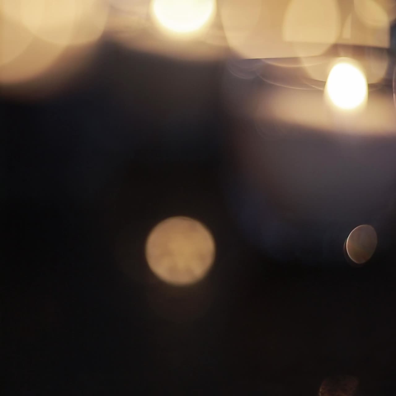 candles burning in tall glass candlestick, a restaurant, banquet, decoration, candles at the wedding table, decorative candles are lit on the festive table, close-up
