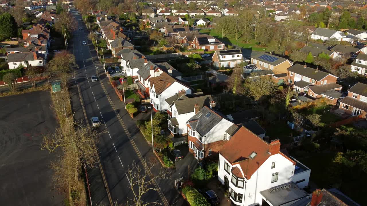 Aerial view expensive British middle class property in rural suburban neighbourhood during autumn